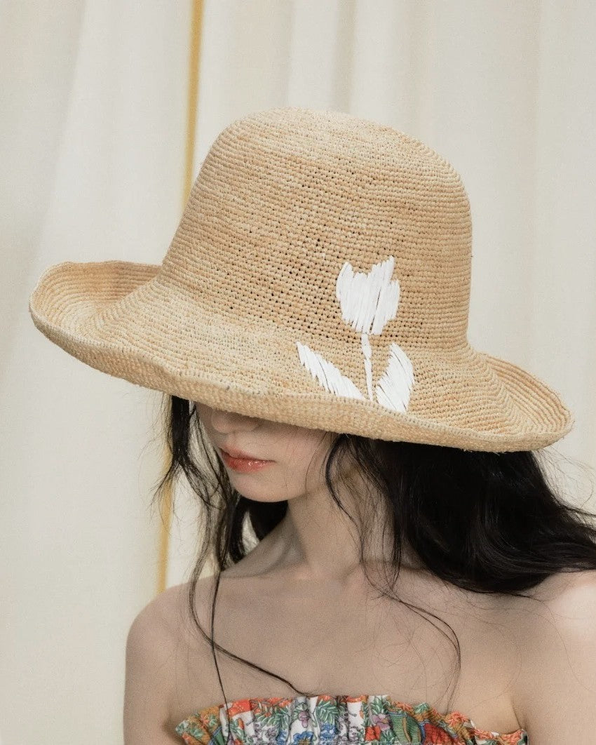 Wildfool Raffia Tulip Sun Hat in Honey — lifestyle outdoor setting, natural light