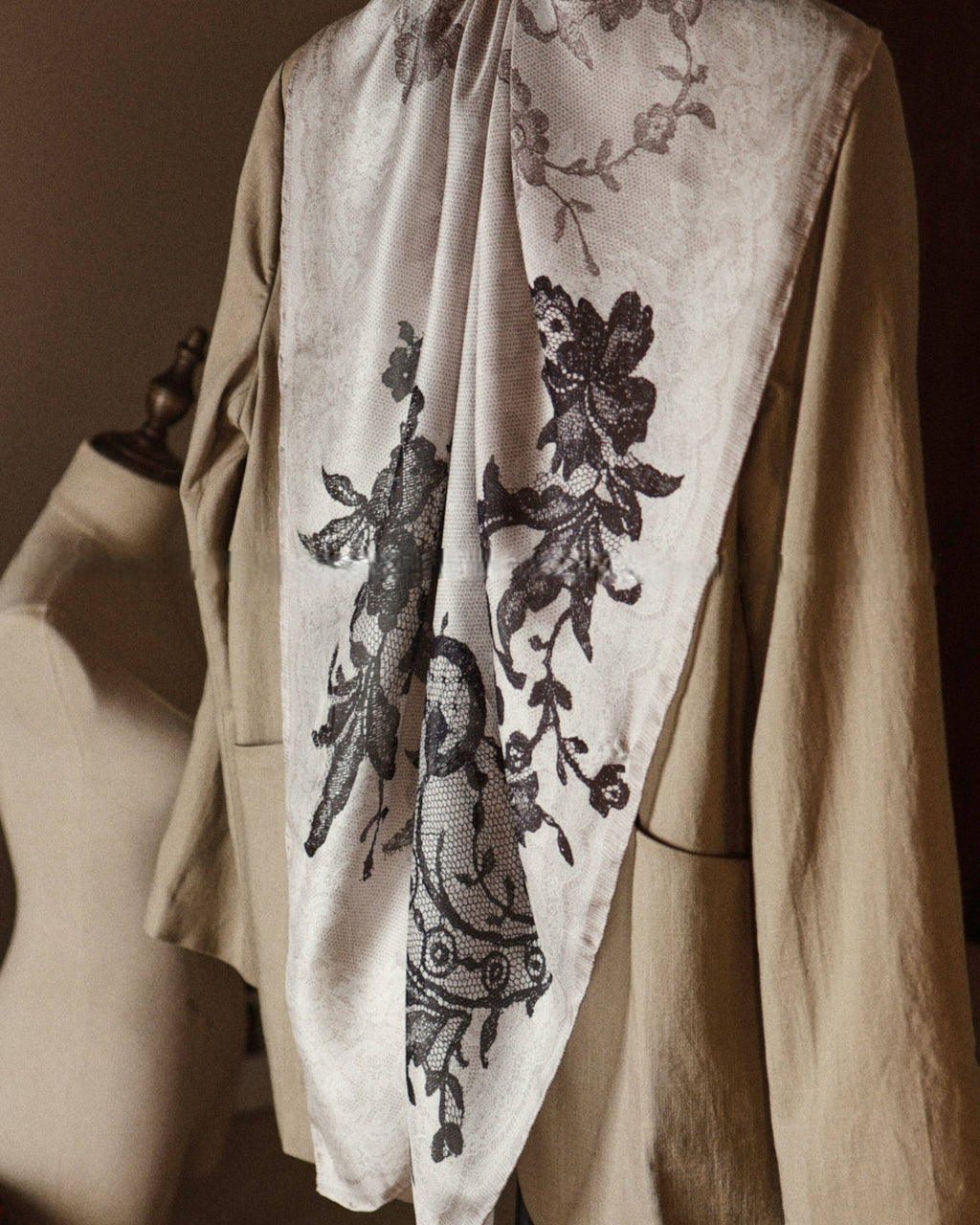 Wildfool silk chiffon scarf with lace floral print — held to light showing transparency