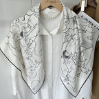 Line-drawn rabbit motif detail on white mulberry silk — Wildfool square scarf close-up