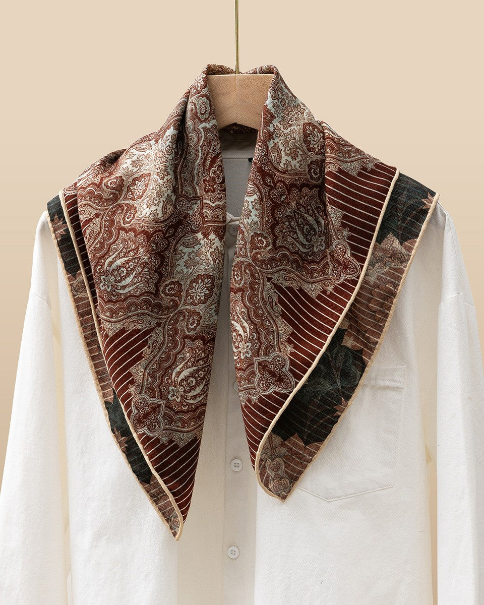 Close-up of Persian kashmir carving detail in brick-red on silk wool blend
