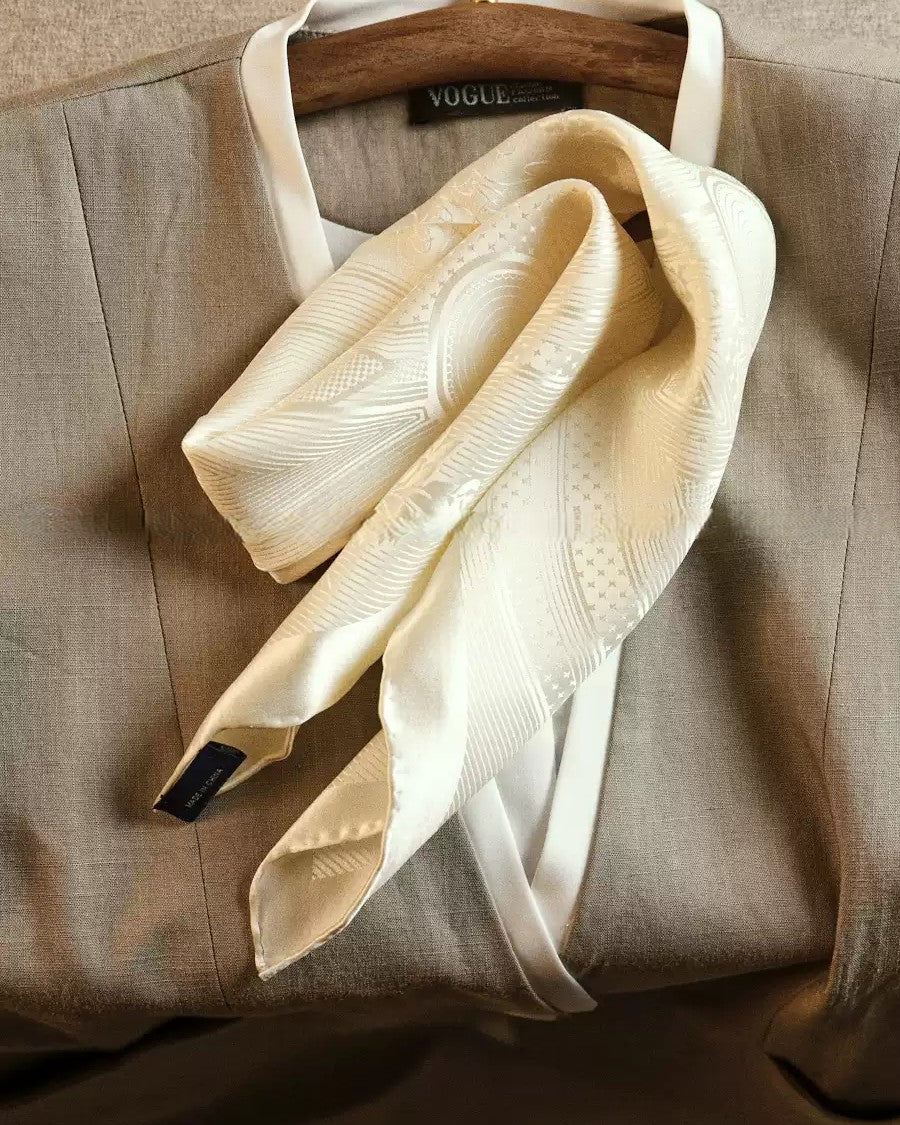 Wildfool ivory silk scarf folded showing jacquard pattern catching light at angle