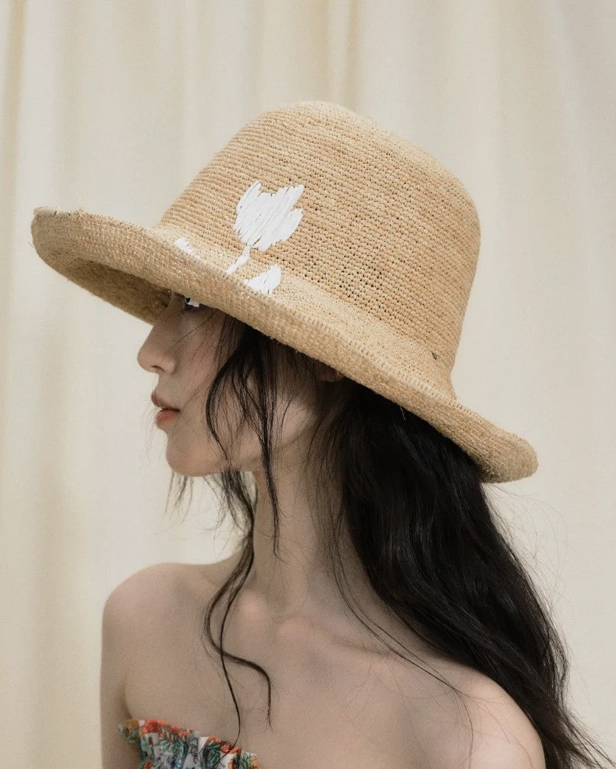 Wildfool Raffia Tulip Sun Hat in Honey — lifestyle outdoor setting, natural light