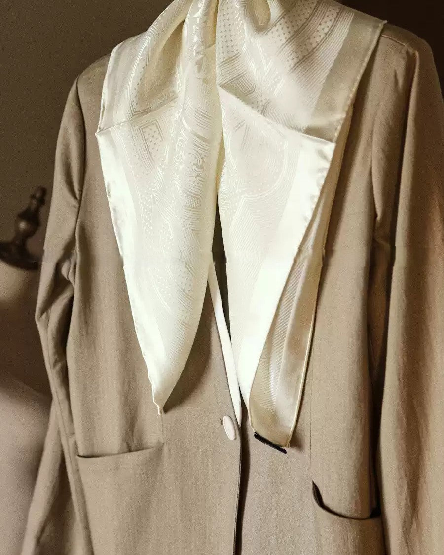 Wildfool ivory silk scarf folded showing jacquard pattern catching light at angle