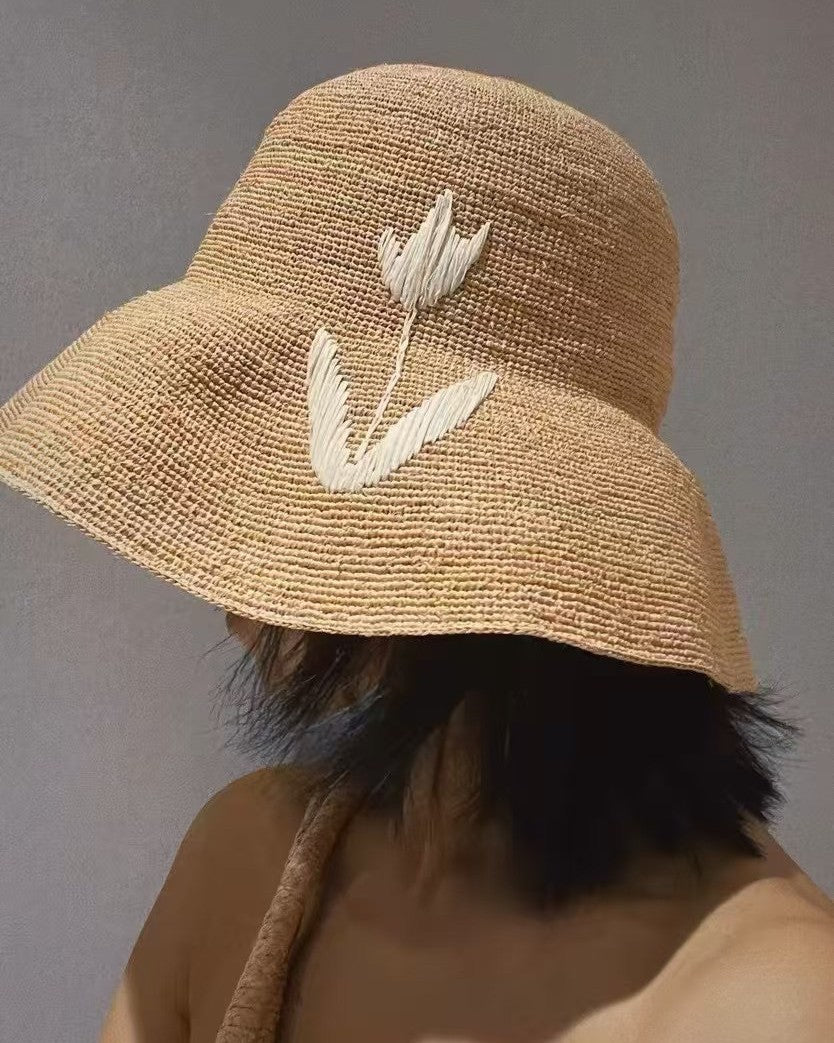 Wildfool Raffia Tulip Sun Hat in Honey — lifestyle outdoor setting, natural light