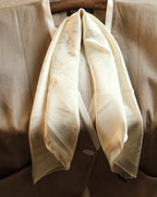 Wildfool ivory silk scarf folded showing jacquard pattern catching light at angle