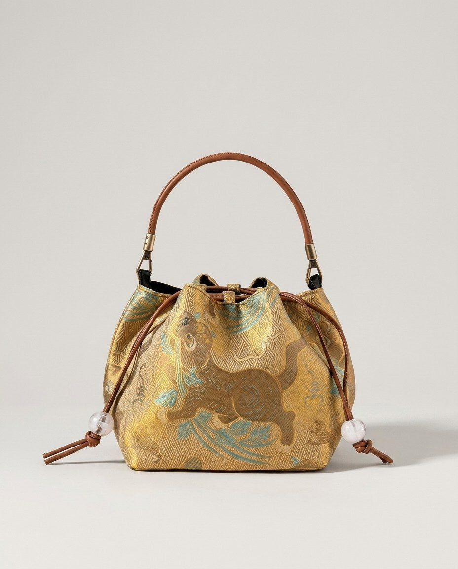 Wildfool The Brocade Bucket Bag in Gilded Tiger — gold silk-blend jacquard drawstring bag