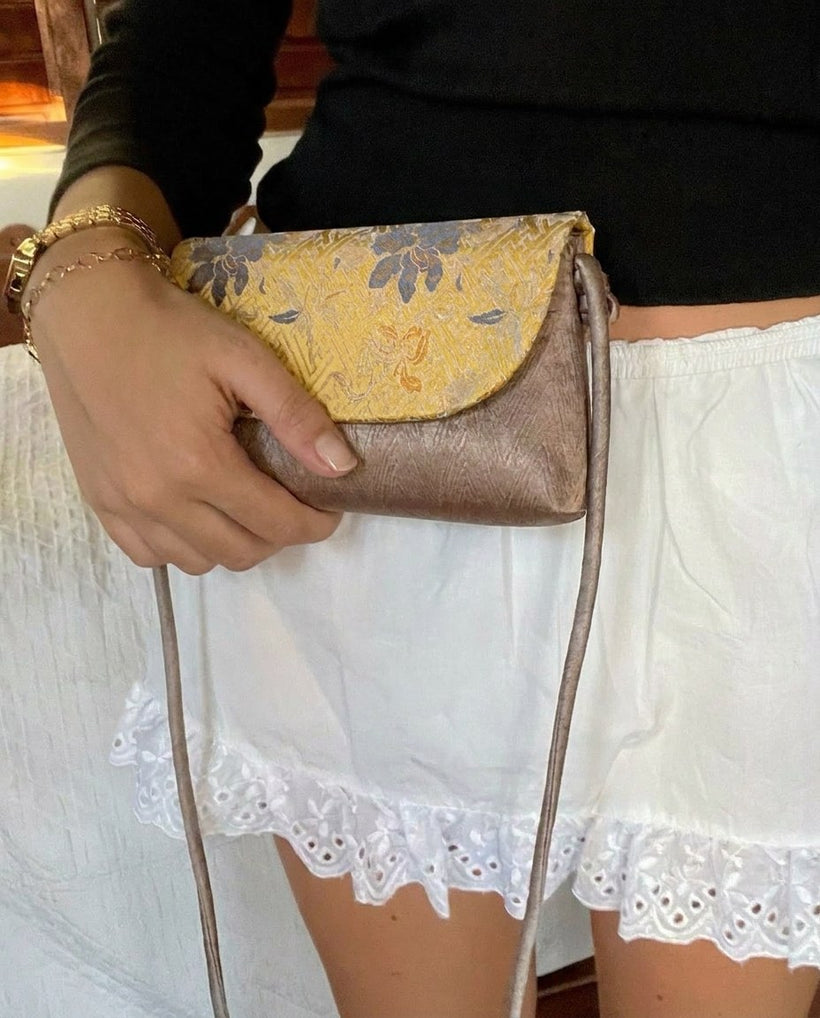The Brocade Flap Crossbody — worn