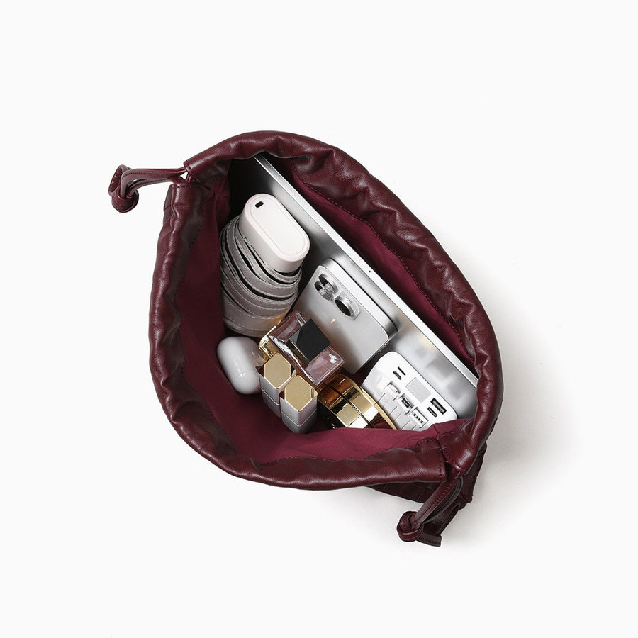 The Matera Woven Pouch — What fits