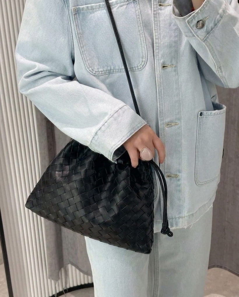 The Matera Woven Pouch — worn