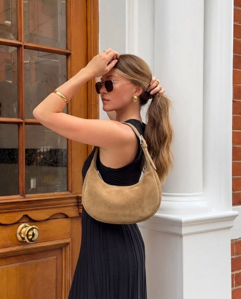 The Cassis Crescent Bag — worn