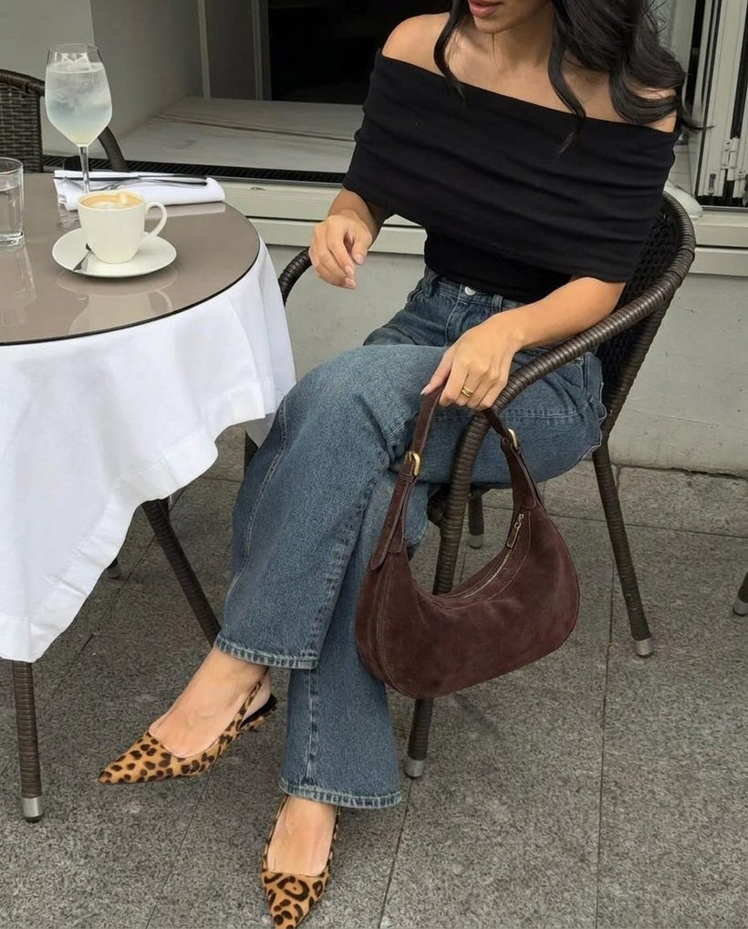 The Cassis Crescent Bag — worn