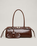Wildfool The Roma Bowling Bag in Espresso — oil-waxed leather bowling bag with belted top and snap pouch