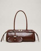 Wildfool The Roma Bowling Bag in Espresso — oil-waxed leather bowling bag with belted top and snap pouch