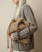 Wildfool Beaded Grass Tote in Khaki — front flat lay showing drawstring closure