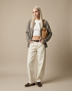 Woven straw bag in khaki tone — close-up of medium-firm weave texture