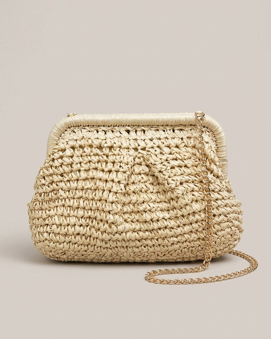 Woman wearing Wildfool camel straw crossbody on black dress — side angle