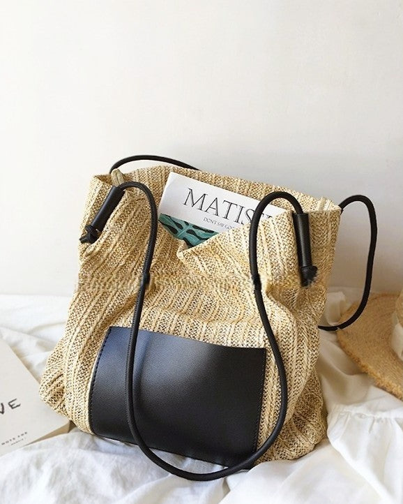 Wildfool black woven tote — flat lay on neutral background