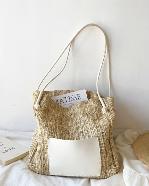 Wildfool black woven tote — flat lay on neutral background