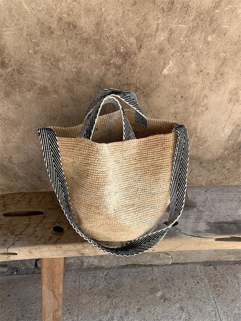 Wildfool The Taormina Raffia Tote — detail view, black-and-cream herringbone webbing strap