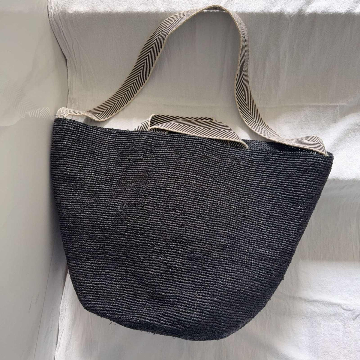Wildfool The Taormina Raffia Tote in Black — raffia tote with black-and-cream herringbone webbing strap