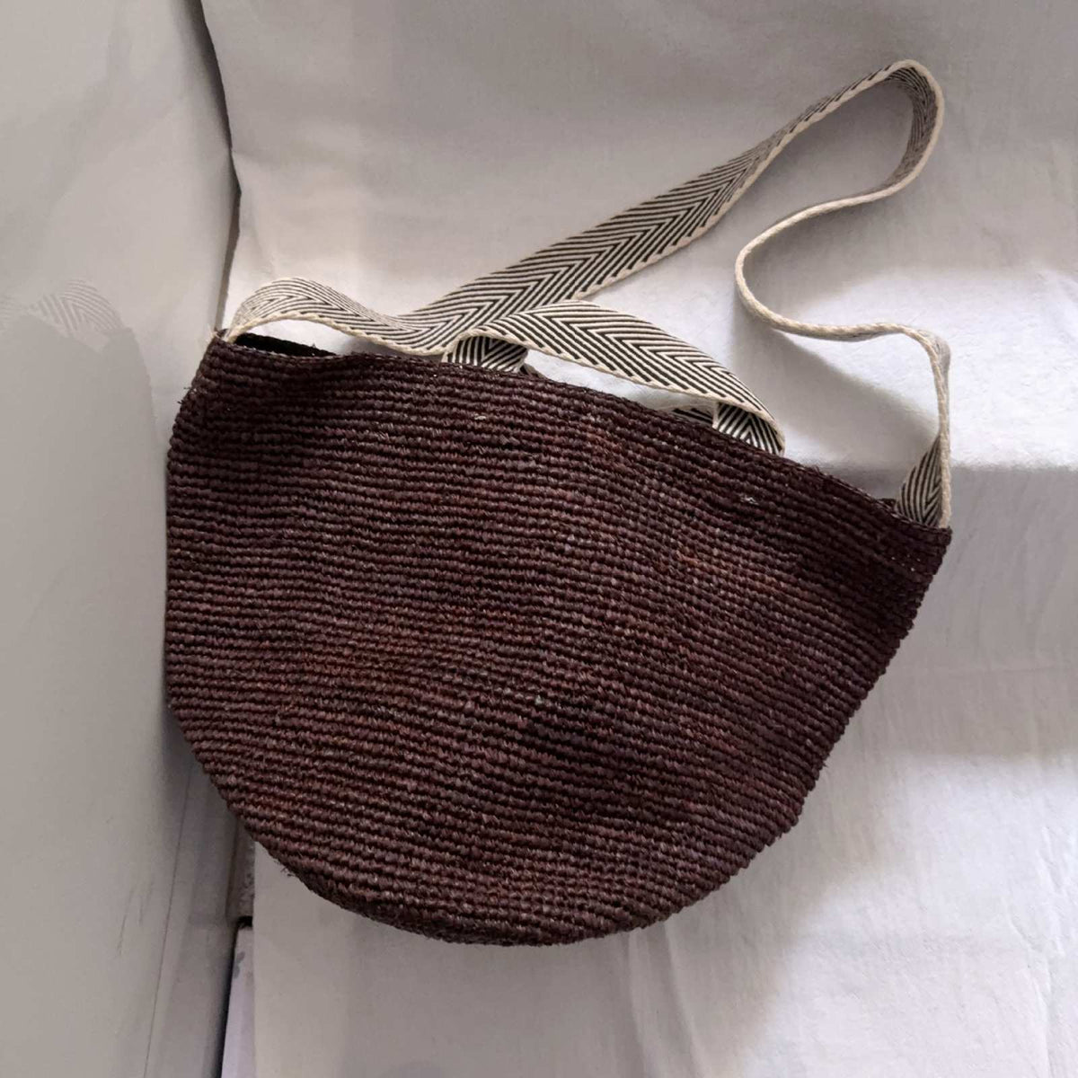 Wildfool The Taormina Raffia Tote in Espresso — raffia tote with black-and-cream herringbone webbing strap