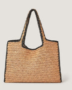 Wildfool The Vernazza Straw Tote in Camel — hand-crocheted paper straw tote with black trim