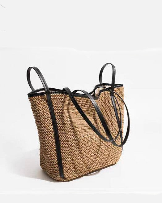 Brown woven tote detail — buckle and drawstring closure mechanisms