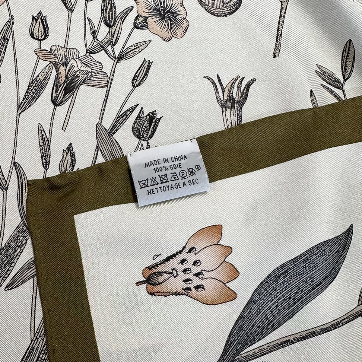 Close-up of poppy and fern botanical illustration detail on Wildfool 18mm silk scarf