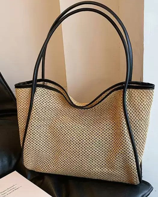 Brown woven tote detail — buckle and drawstring closure mechanisms