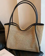Brown woven tote detail — buckle and drawstring closure mechanisms