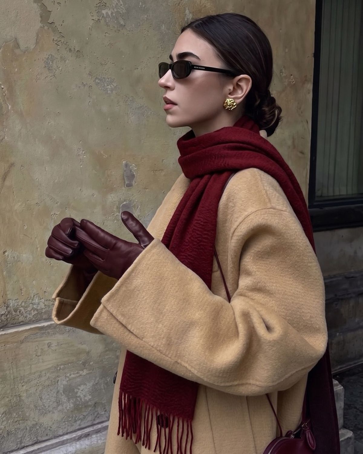 The Dune 100% Cashmere Scarf in Burgundy, worn with a camel coat