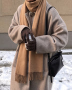 The Dune 100% Cashmere Scarf in Camel, worn outdoors