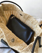 Wildfool black woven tote — flat lay on neutral background