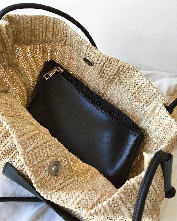 Wildfool black woven tote — flat lay on neutral background