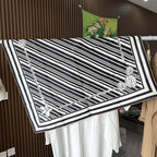 Wildfool 88cm graphic silk scarf worn as triangle headscarf showing stripe and bloom interplay
