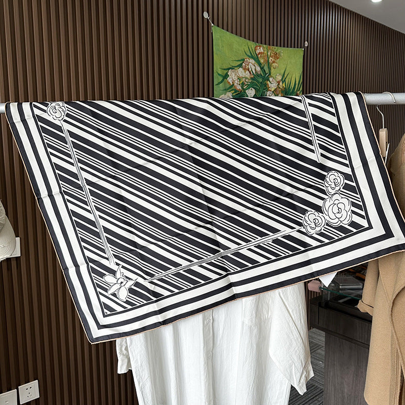 Wildfool 88cm graphic silk scarf worn as triangle headscarf showing stripe and bloom interplay