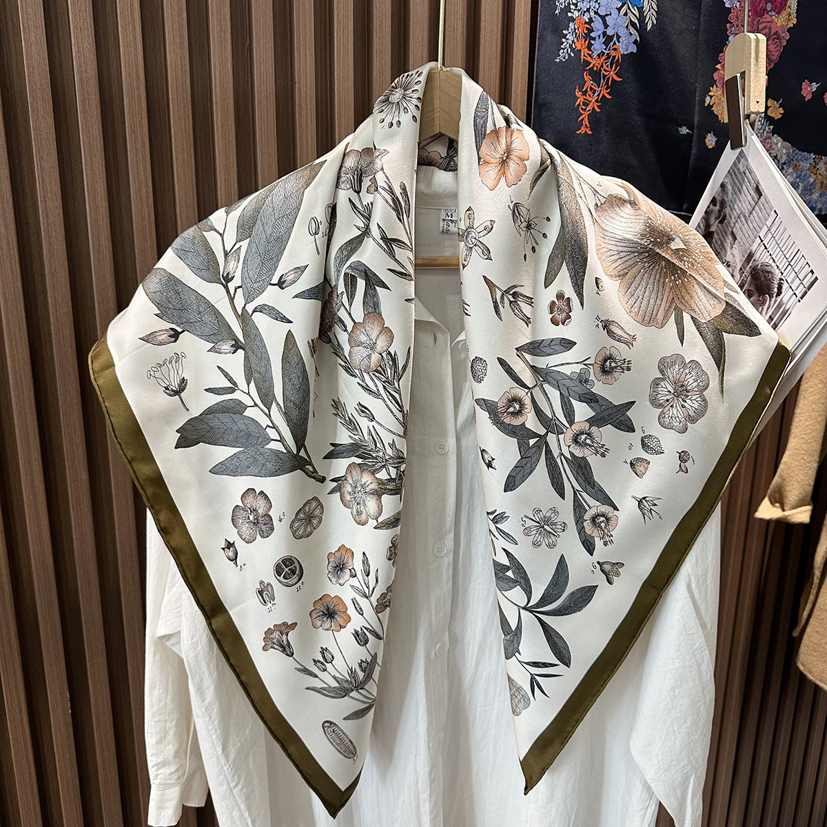 Hand-rolled edge detail on Wildfool 90cm botanical print mulberry silk scarf