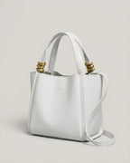 The Tivoli Bucket Bag in Chalk White, three-quarter angle view