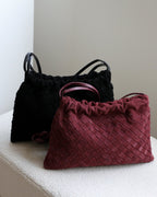 Wildfool The Mantova Drawstring Pouch in Black and Burgundy, side by side