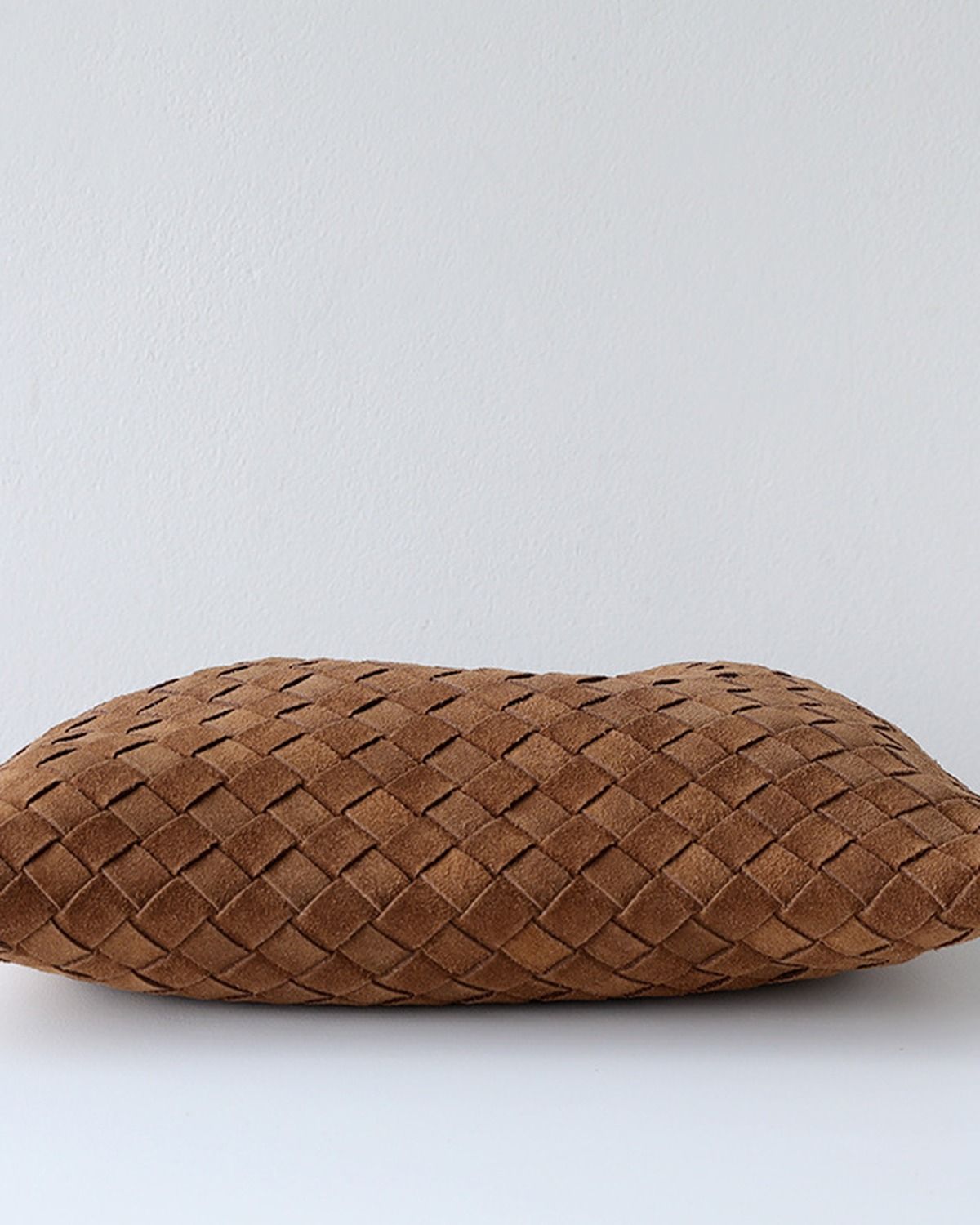 Wildfool The Mantova Drawstring Pouch in Caramel, pulled shut and laid flat