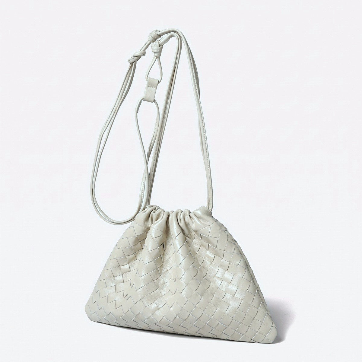 Wildfool The Matera Woven Pouch in Ivory — soft off-white hand-woven lambskin drawstring bag