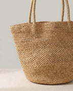 Wildfool The Hand-Woven Raffia Market Tote — flat lay with summer accessories