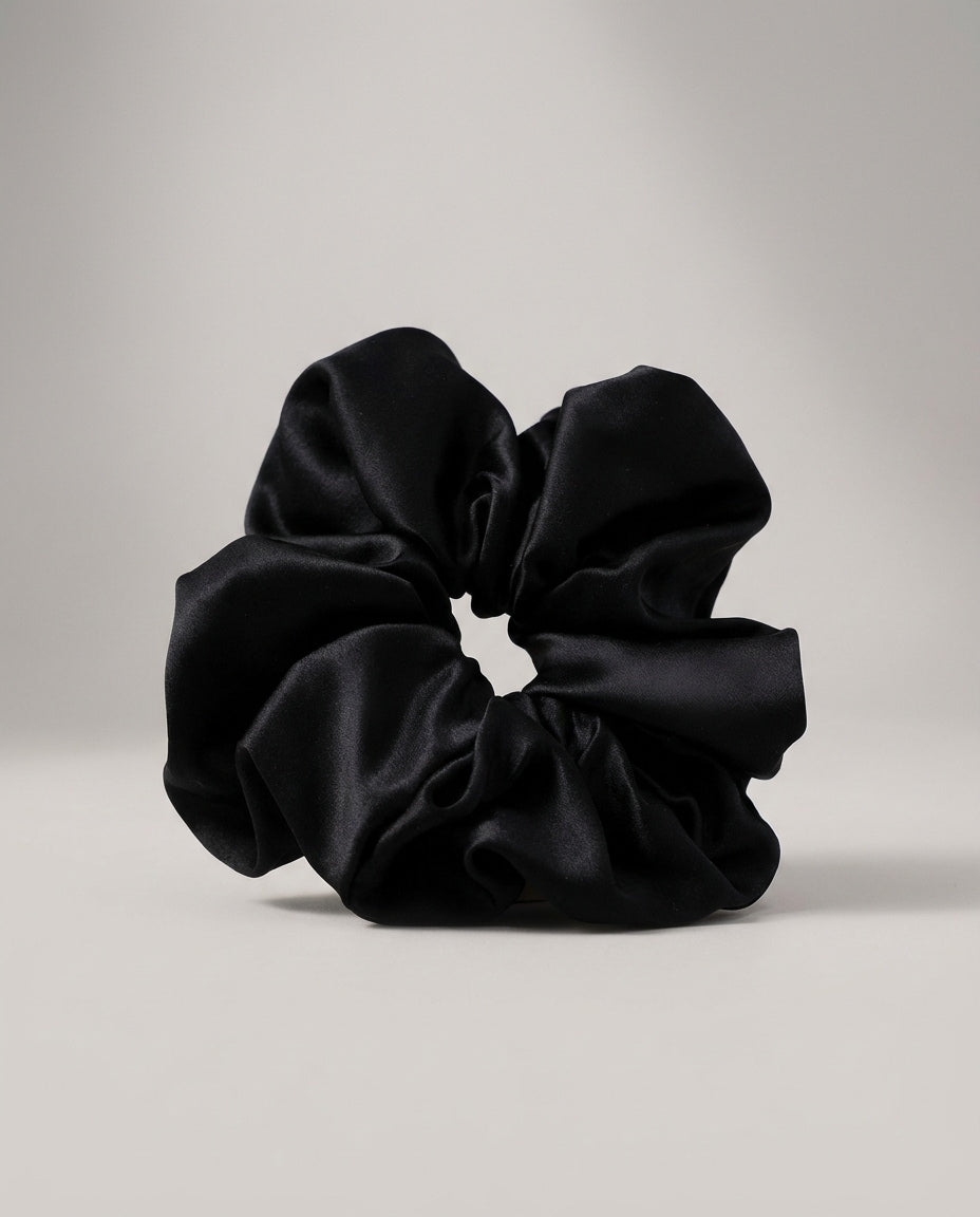 Comparison shot — 30-momme heavyweight silk scrunchie next to a thin 16-momme version for scale