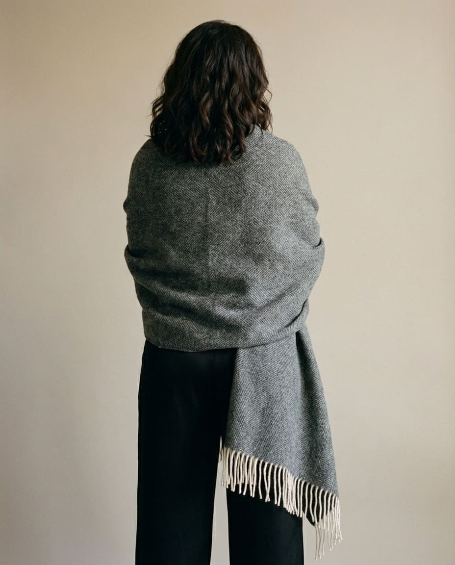 Color range overhead — oat, slate, dusty pink herringbone cashmere-blend throws