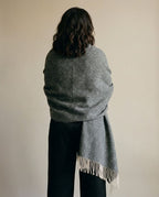 Color range overhead — oat, slate, dusty pink herringbone cashmere-blend throws