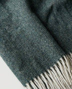 Wildfool herringbone cashmere-blend throw alternative angle on hardwood floor