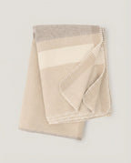 The Nomad Twill Wool Throw in Beige, folded