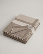 The Nomad Twill Wool Throw in Oat, folded