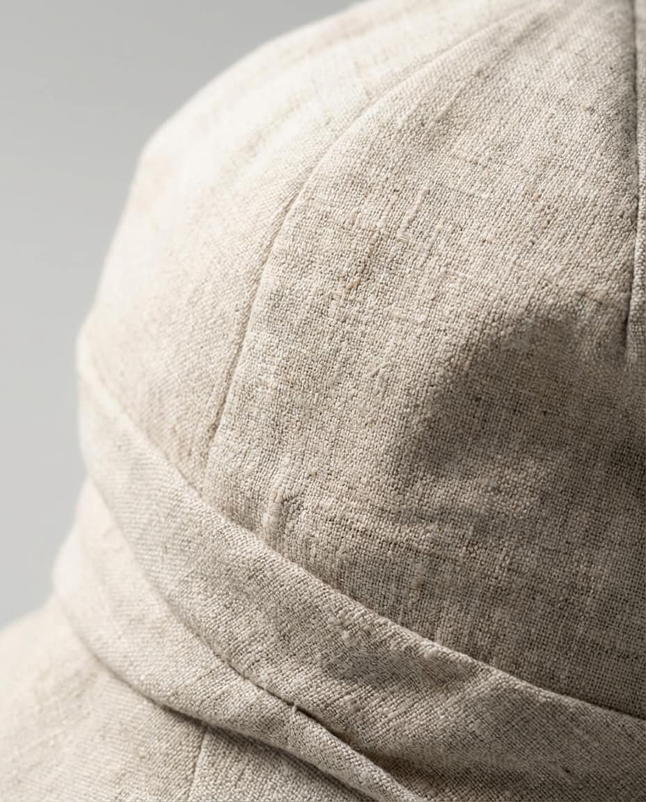Wildfool 100% Linen Packable Bucket Hat in Oatmeal Beige - Lifestyle Photography - 100% Linen with Wire Brim, Fully Packable, Adjustable Fit