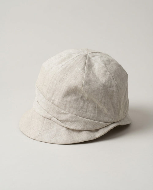 Wildfool 100% Linen Packable Bucket Hat in Oatmeal Beige - Lifestyle Photography - 100% Linen with Wire Brim, Fully Packable, Adjustable Fit